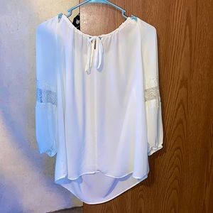 loose, Medium women’s dress shirt. The bow is adjustable.